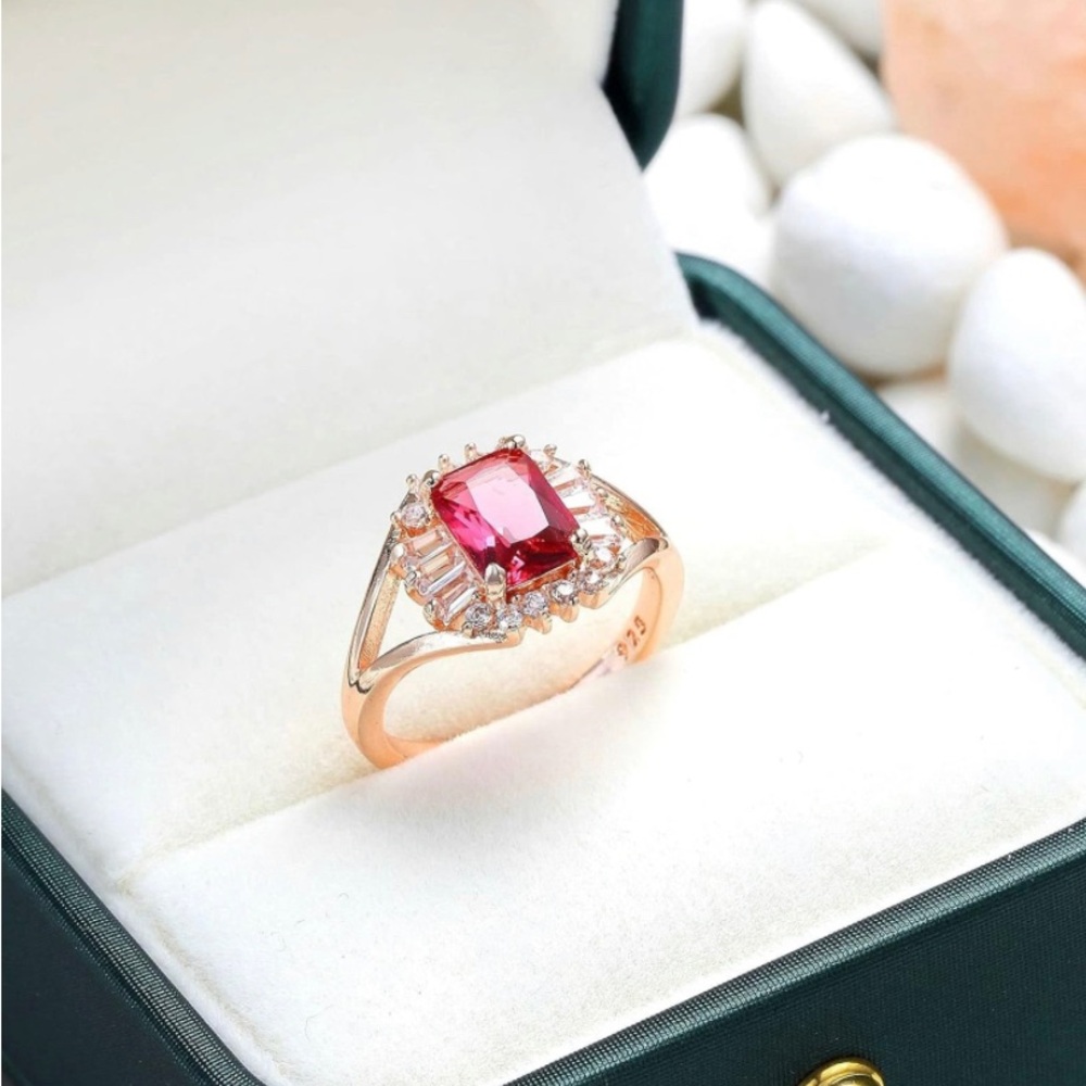 Rose gold colored halo faux ruby ring